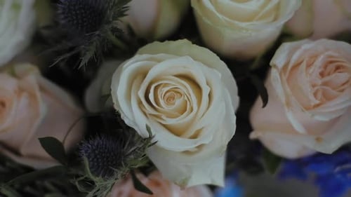 Close up White and cream roses Bouquet on wedding day.