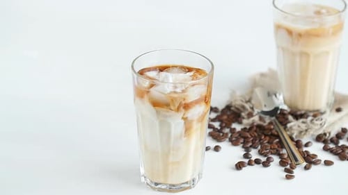 Iced Coffee Pouring Milk into Glass