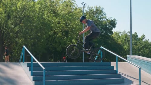 Young Adult Biking at Skate Park