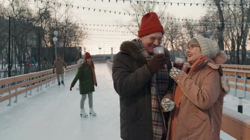 Senior Couple at Outdoor Ice Skating Rink
