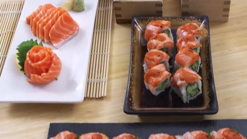 Fly over a variety of fresh sushi trays and platters.