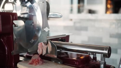 Meat Slicer Slicing Thin Slices of Meat