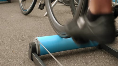 Bicycle Spinning on a Blue Bike Roller Trainer
