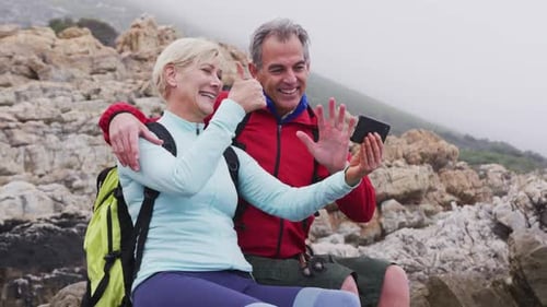 Couple Video Calling on Rocky Hike Overlook