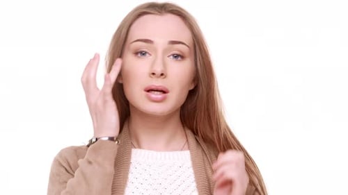 Young Woman Adjusts Hair and Applies Lip Balm