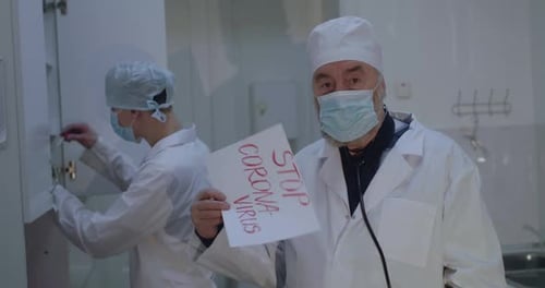 Doctors with Sign in Hospital Fighting Corona Virus