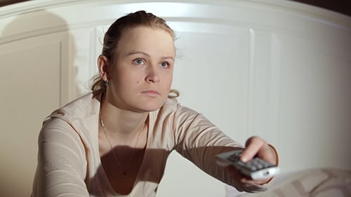 Woman Changing TV Channels