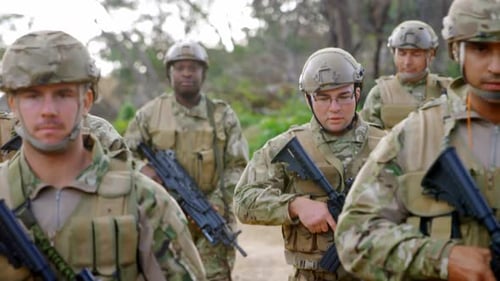 Front view of mixed-race military soldiers rifle training in fields during military training 4k