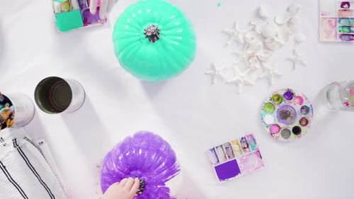 Flat lay. Step by step. Painting craft pumpkin with acrylic paint to create decorated mermaid Hallow