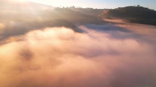 4K Drone Flying through the clouds at dusk or dawn. Aerial top cloudscape