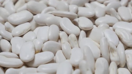 White raw beans also known as haricot beans food close-up 4K 2160p 30fps UltraHD food video- Shall