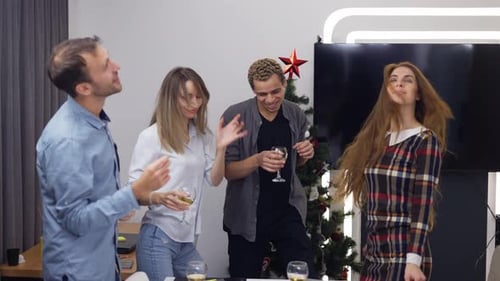 Diverse Group of Joyful Businesspeople Having Party and Dancing in Office