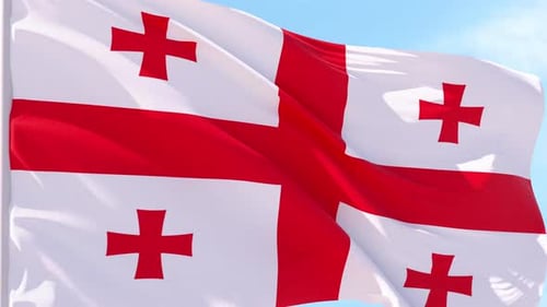 Realistic Georgian Flag Waving Against Blue Sky