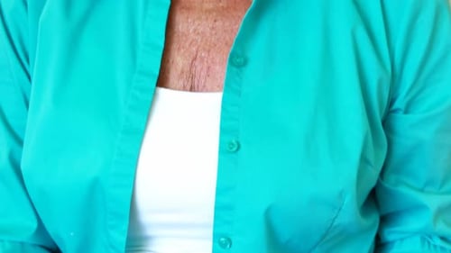 Senior Woman Using Laptop with Credit Card