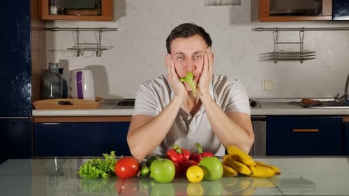 Sad Hungry Man Eats Fresh Lettuce Following Wellness Diet