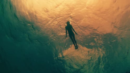 Young Woman Snorkeling and Swimming in the Sea in the Maldives