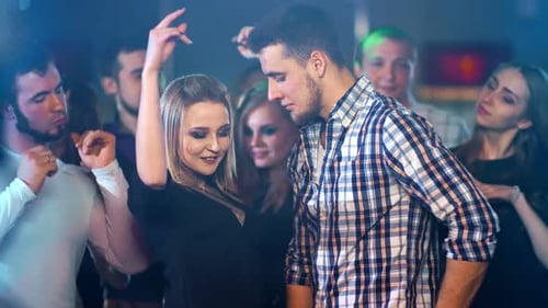 People Dancing at a Nightclub Party
