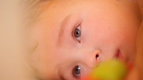 Young Child Lying Down Looking Up