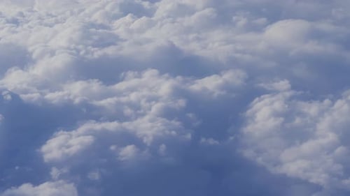 Aerial view of cloudy sky from airplane windows