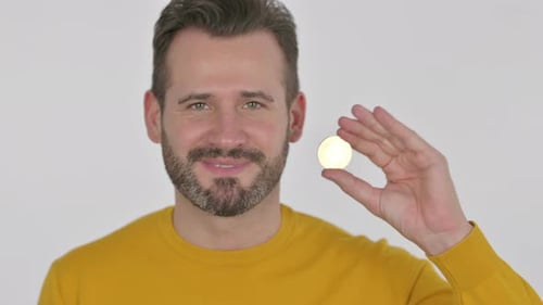 Portrait of Middle Aged Man Holding Bitcoin Crypto Currency