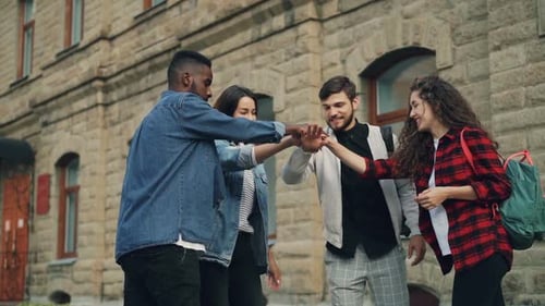 Smiling Friends Celebrate Achievement on University Campus