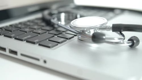 Stethoscope on Laptop Keyboard Close Up