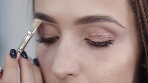 Cropped View of Girl's Face in Process of Doing Makeup