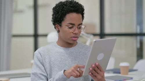 African Woman Using Digital Tablet