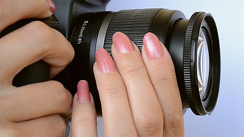 Close-Up of Woman Holding a Camera
