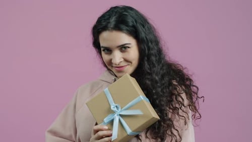 Young Adult Woman Offering Birthday Gift