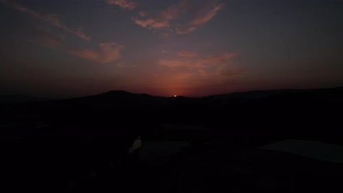 Dramatic Aerial Sunset Over Mountains
