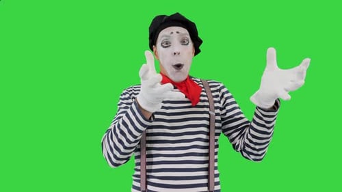 Mime Artist bläst imaginären Ballon auf Greenscreen-Chroma-Key