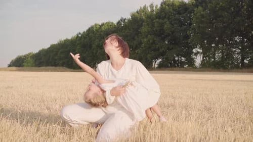 Mom and Daughter Playing Field Mother Catch Up Child Holding Hug Child
