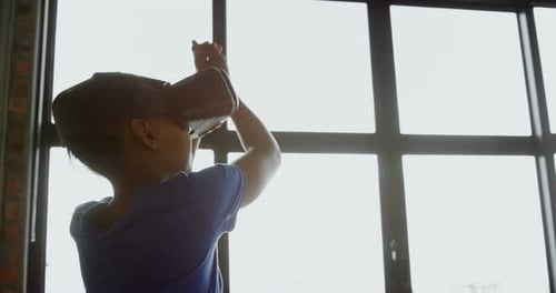 Girl using virtual reality headset in office