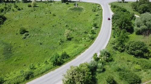 Aerial drone view of a flying over the rural agricultural landscape.