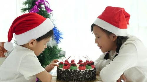 Joyful Children Eating Christmas Cake Together