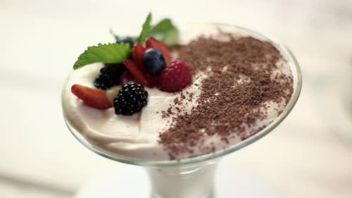 Decadent Dessert Topped with Berries and Chocolate