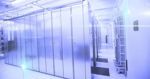 Computer servers in a server room with glowing lights