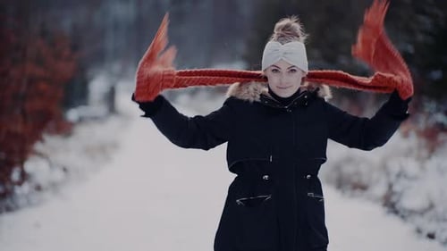 Woman Wearing Scarf on Neck in Winter Outdoors
