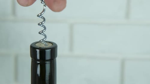 Uncorking a bottle.