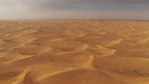 Aerial view of red Desert Safari with sand dune in Dubai City, United Arab Emirates or UAE