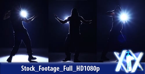 Silhouetted Man Dancing in the Dark with Bright Light