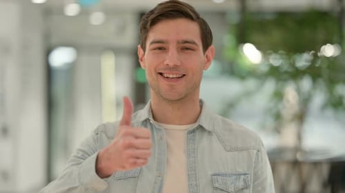 Man Smiling and Giving Thumbs Up Approval