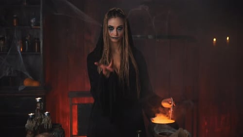 Woman in Hooded Robe with Cauldron