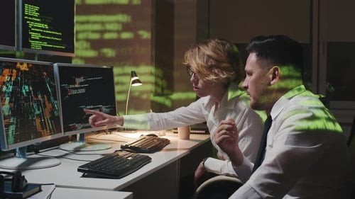 Co-workers Staying Late In Office