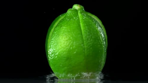 Lime Being Sliced into Pieces in Slow Motion