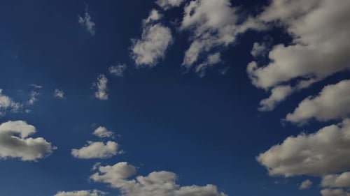 Blue Sky with Moving White Clouds