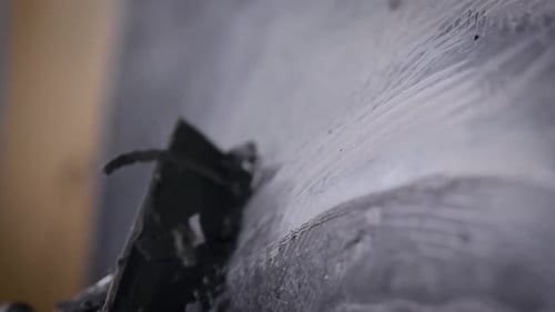 Sculptor Is Polishing Industrial Sample From Black Modeling Clay in Workshop Making Models for