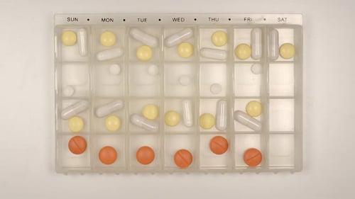 Time Lapse of Pills Filling Pill Organizer