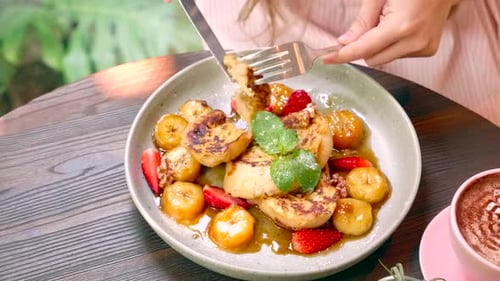 French Toast Breakfast with Bananas and Strawberries